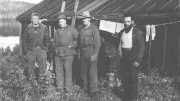 Bush pilot George Smith, left, with Harry Buckles, second from left, a local prospector and the camp cook. The picture was taken during the staking rush of early 1953, near what would become the Nordic mine in the middle belt of the "Z" pattern sedimentary contact.