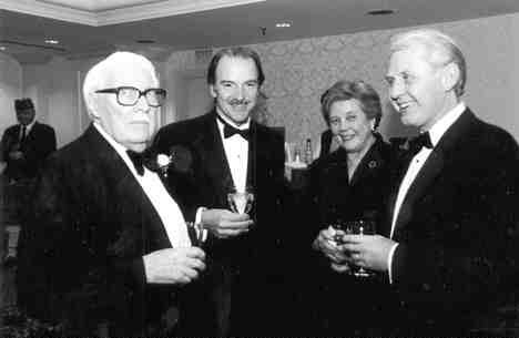 CMHF inductee Marsh Cooper (left) chats with Pierre Lassonde, president of Franco-Nevada Mining, Barbara Yates, and Oyvind Hushovd, president of Falconbridge (right).