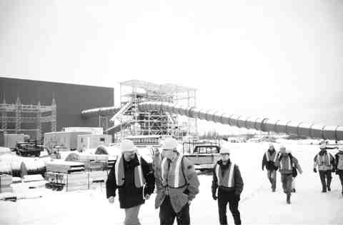 Keith Minty (centre) leads a group of analysts on a tour of the new mill under construction at the soon-to-be expanded Lac des les mine, near Thunder Bay, Ont.