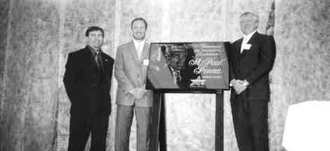 Mine manager Paul-Henri Girard (left), CEO Sean Boyd and COO Ebe Scherkus pose alongside a plaque honouring Paul Penna, founder of Agnico-Eagle Mines. It was unveiled during the recent inauguration of a new shaft at LaRonde.