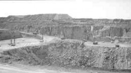 Haulage trucks carry ore to the new mill at the expanded Lac des les palladium mine in northwestern Ontario.