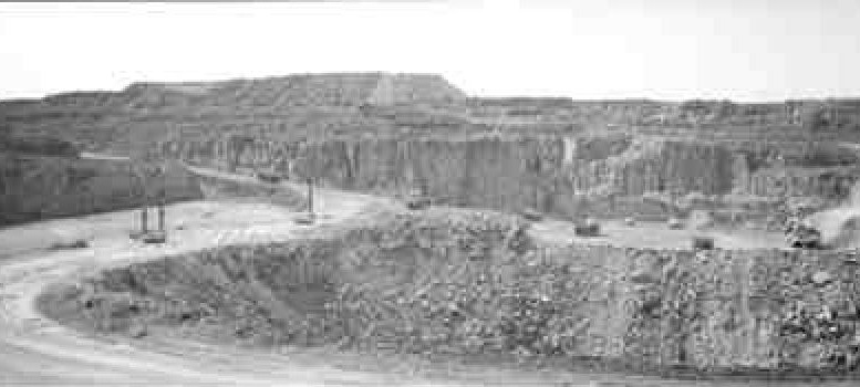 Haulage trucks carry ore to the new mill at the expanded Lac des les palladium mine in northwestern Ontario.