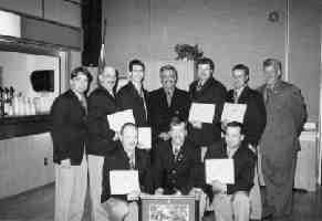 The Falconbridge Craig-Lockerby team receives its Ontario mine rescue championship plaques. From left in front: James Lundrigan, Thomas Dwyer and Ronald Cormier. In back from left: Dan McIntosh, Brian Benoit, Peter Xavier, Parvis Farsangi (Falco general manager in Sudbury), David Lachance, Marc Girard and John Hagan (mine rescue officer with the Mines and Aggregates Safety and Health Association).