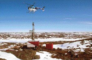 A helicopter lowers a drill boom on to the High Lake property in Nunavut.
