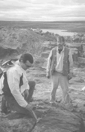 Cumberland Interim President Kerry Curtis (left) and Project Manager Brian Alexander review 1999 trenching results on Meadowbank's Third Portage deposit, one of the key proposed open pits.