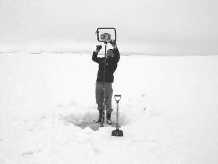 Diamonds North's Dean Mason, camp manager at the Blue Ice diamond project on Victoria Island, Nunavut, augers through ice to find water for winter drilling.