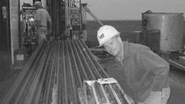 Ivanhoe geologist Cyrill Orssich inspects drill core from the Far North zone at Oyu Tolgoi in Mongolia.