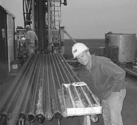 Ivanhoe geologist Cyrill Orssich inspects drill core from the Far North zone at Oyu Tolgoi in Mongolia.