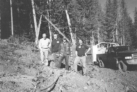 Imperial Metals' Mount Polley team stands on the newly discovered Northeast zone. From left: Pierre Lebel, chairman; Art Frye, senior mine engineer; Patrick McAndless, VP exploration; Brian Kynoch, president.