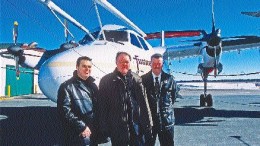 From left, Noranda's exploration manager in the Bathurst camp, Normand Dupras, New Brunswick Minister of Natural Resources Keith Ashfield, and Slam Exploration President Michael Taylor in front of a Fugro Dash-7. The aircraft is to conduct Megatem surveys over the Bathurst camp (see map, right). Noranda and Slam are involved in joint effort to outline base metal reserves for the Brunswick smelter, which is slated to close in 2008 unless more reserves are found. The provincial government is subsidizing the program.