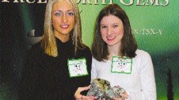The hunt for precious stones in Canada also extends to emeralds and sapphires. Above, Holly Johnson, an office administrator with True North Gems, and geologist Bonnie Pemberton hold emerald and sapphire mineralization from the Yukon and Baffin Island, respectively.