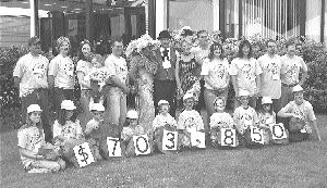 The Mining for Miracles Committee presents a cheque for $703,850 to the British Columbia Children's Hospital. The annual Mining for Miracles Gold Rush Fair and Celebrity Pie Throw, hosted by Vancouver-based Teck Cominco, raised $354,000. Some of the celebrities receiving pies included former Mining Association of British Columbia President Gary Livingstone, Western Keltic Mines President Donald McInnes, and Teck Cominco CEO David Thompson. A pie in Thompson's face raised $205,000. As part of the fundraiser, a $25,000 diamond was donated by BHP Billiton Diamonds and raffled. For more information about donations, e-mail Celina Sookachoff at celina.sookachoff@teckcominco.com