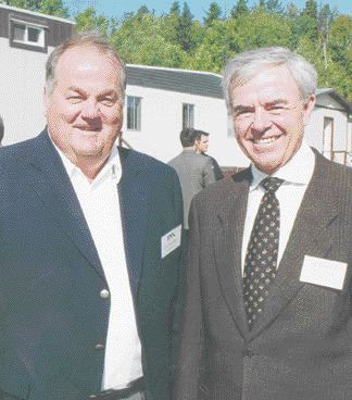 Terry MacGibbon, president and CEO of FNX Mining (left), and Robert Dengler, president and CEO of Dynatec, celebrate the reopening of their McCreedy West nickel mine, north of Sudbury, Ont.