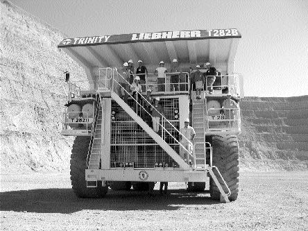 The Northern Miner's Rob Robertson (bottom right) stands on one of the 400-ton haul trucks in the Pipeline-South Pipeline pit at the Cortez mine in northeastern Nevada.