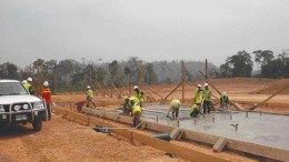 A construction crew pours building foundations at Red Back Mining's Chirano gold project in Ghana.