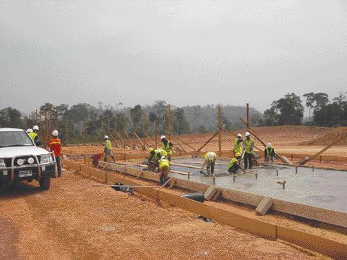 A construction crew pours building foundations at Red Back Mining's Chirano gold project in Ghana.