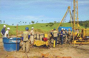 Workers test Canico Resource's Ona-Puma nickel laterite project.