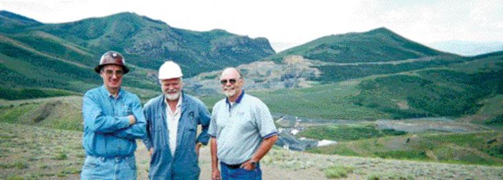 At the Jerritt Canyon property in Nevada's Independence Mountain range, from left: Nigel Bain, general manager at Jerritt Canyon; Chris Davie, Queenstake Resources president and CEO; and Ted Wilton, district exploration manager at Jerritt Canyon. In the near background are the surface buildings at the SSX portal, and in the far background, some exhausted open pits.