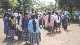 Qeqchi gather in a village just northwest of the Exmibal ferronickel plant on Guatemala's Lake Izabal.