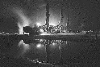 Geologist Arnand Van Heerden submitted Earth Breaking Reflection, a photo depicting three drills working under moonlight at Gold Field's Tarkwa gold mine in Ghana. The photo was awarded second prize.