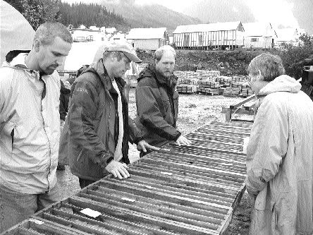 From left: NovaGold Senior Project Geologist Scott Petsel, President and CEO Rick Van Nieuwenhuyse and Vice-President of Corporate Communications Greg Johnson examine drill core from hole 514 at the Galore Creek copper-gold project in northwestern B.C.