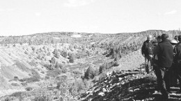 Dianor Resources President John Ryder (right) shows visitors the Lena Creek drainage basin near Wawa, Ont., where prospector Joe Leadbetter found diamonds while panning.