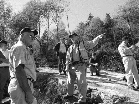 Marathon's chief executive Phillip Walford shows off some features on stripped outcrops of the BR zone mineralization at the Marathon project in north-central Ontario.