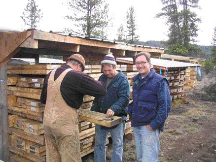 From left: Hard Creek Nickel project manager and COO Tony Hitchins, engineer Neil Froc, and president and chair Mark Jarvis examine core at the Turnagain nickel project in north-central B.C. Recent drilling increased the project's potential for more nickel.