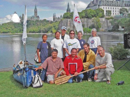 In summer 2005, Chief Glenn Nolan (centre, red sweater) of the Missanabie Cree First Nation, led a canoe trip to commemorate the 100th anniversary of the signing of Treaty 9, which encompasses the northern portion of Ontario. The 3-month journey involved celebrations in many of the 49 communities inside the treaty boundaries and concluded with a ceremony in Canada's capital, Ottawa. Nolan is a PDAC director and a member of the association's Aboriginal Affairs Committee.