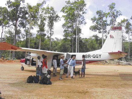 BY STEPHEN STAKIWAnalysts and other guests arrive at the recently built airstrip at StrataGold's Tassawini gold project in the jungles of northwestern Guyana. The 850-metre airstrip was cut out of the jungle to facilitate turboprop flight access direct from Georgetown, thereby trimming travel time from about a day to less than an hour.