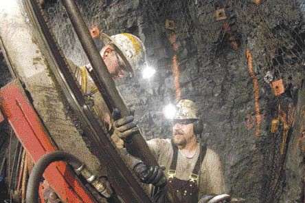 QUEENSTAKE RESOURCESTwo underground miners conduct production drilling underground at the Jerritt Canyon mining complex in Nevada. Owner Queenstake Resources posted a net loss of US$19.7 million in 2005 on production from Jerritt Canyon, a slight improvement over 2004.