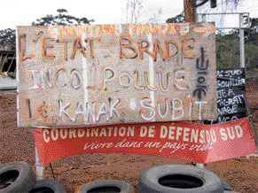 MINING WATCHThis protester's sign near the Goro nickel project in New Caledonia roughly translates to "Goro-Nickel, a cursed project. The state sells off, Inco pollutes, and Kanak people suffer." Inco, which owns Goro through its subsidiary, Goro Nickel, says protesters in the area recently committed more than $10 million in damages on the company's property.