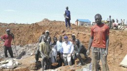 In February 2005, Anvil Mining president William Turner poses with artisanal cobalt miners at a site a few kilometres outside the town of Mutoshi where the company operates the Kulu copper mine. Local protesters recently killed two of Anvil's staff at Kulu following the death of local artisanal miner, 30-year-old Kayembe Mukoj, allegedly at the hands of Anvil security personnel.BY THE NORTHERN MINER