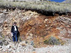 SOUTHWESTERN RESOURCESJohn Paterson, president and CEO of Southwestern Resources, stands by an exposure of zinc oxide mineralization at the Accha deposit in southern Peru.