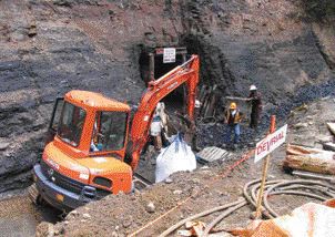 COMPLIANCE ENERGYCollecting bulk sample bags from a refurbished adit at the Raven coal deposit on Vancouver Island.