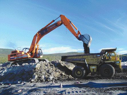 PINE VALLEY COALA backhoe loads a truck at Pine valley Coal's Willow Creek mine in northeastern B.C. where the company recently learned that its coking coal pit there contained three times more oxidized coal than had been anticipated.