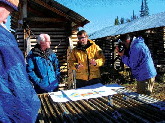 VIVIAN DANIELSONWestern Keltic Mines' vice-president of exploration, Peter Holbek (centre, yellow), explains the geology of the Kutcho Creek massive sulphide project during a site visit to Dease Lake, northern B.C.