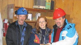 One of the first gold bars to be poured at Cusac Gold Mines' Table Mountain mine in northern British Columbia. From left: Mine manager Kevin Fitzpatrick; vice-president, exploration Lesley Hunt; and Cusac CEO David Brett.