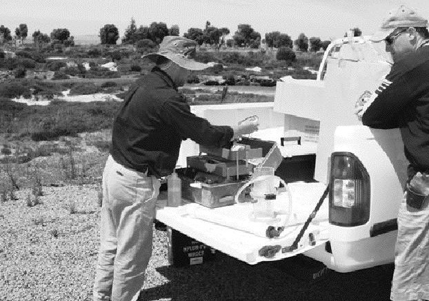 AUSTRALIAN MINERAL FIELDSHydrogeochemical sampling in southeastern Western Australia. The filtration unit on the back of the truck analyzes water from streams for a range of pathfinder elements and economic metals. This method allows a large drainage area to be sampled quickly.