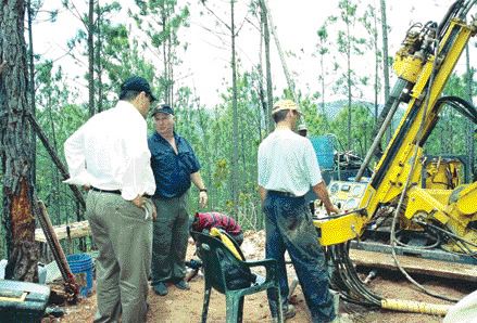 PHOTO BY JOHN CUMMINGUnigold's chairman Talal Ali Al-Shair (left), and COO and vice-president of exploration Daniel Danis (centre) examine a new drill at the company's Los Candelones gold deposit on the Neita property in northwestern Dominican Republic.