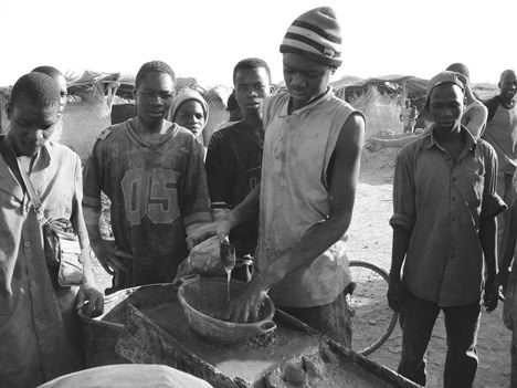 Artisanal miners recover gold in a village in Burkina Faso.