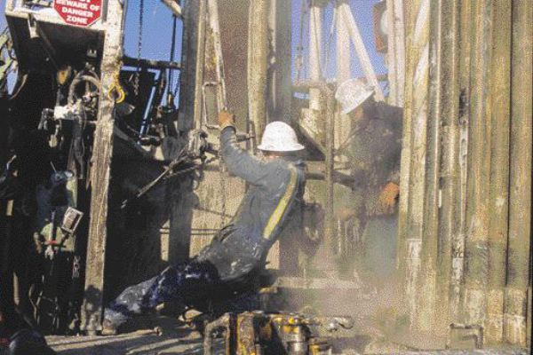 A driller makes a connection while core drilling the Fort Hills project in the Athabasca oilsands. The project is slated to begin production in 2011 and is a joint venture between Petro-Canada, UTS Energy and Teck Cominco.