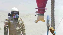 A driller operates a reverse-circulation drill at the Magnetite Manto deposit, roughly 1 km from Mina Justa in southwestern Peru. Chariot Resources plans to use higher-grade oxide ore from Magnetite Manto as a starter pit for the mine, which is scheduled to go into production in 2010.