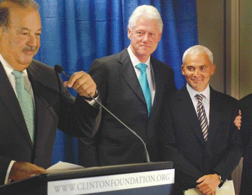 WILLIAM J. CLINTON FOUNDATIONFormer U.S. president Bill Clinton gives Endeavour Capital's former chairman Frank Giustra a hug during a ceremony in New York City announcing Giustra and Mexican telecommunications tycoon Carlos Slim's respective US$100-million donations to the William J. Clinton Foundation, a global charity.