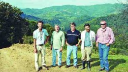 PHOTO BY JOHN CUMMINGCarpathian Gold personnel standing near the Colnic gold-copper porphyry in Romania, with the Rovina copper-gold porphyry in the distance, from left: chief operating officer Randall Ruff; president and CEO Dino Titaro; investor relations manager Michael O'Brien; geologist Albert Fuer; and consulting geologist Sorin Halga.