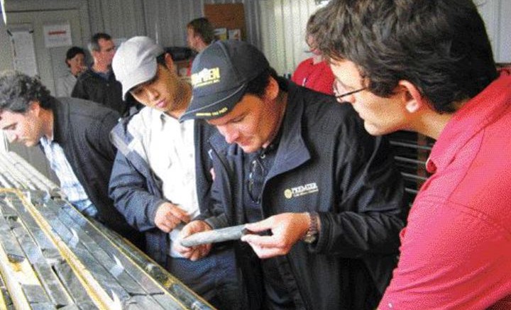 BY JAMES WHYTEPresident Ewan Downie of Premier Gold Mines (with core) and project manager Matt Long (right) examine drill core from the Rahill-Bonanza project in Red Lake, Ont.