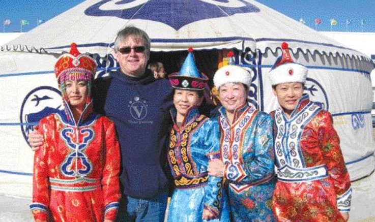 BY TRISH SAYWELLRoger Walsh, Jinshan Gold Mines' VP of corporate development, with staff in traditional finery to welcome guests.