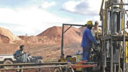 BY ANTHONY VACCAROA worker mans a drill rig while a guard looks on at the Moto gold project in the Democratic Republic of the Congo.