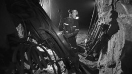 Working a long drill at the 777 copper-zinc mine in Flin Flon, Manitoba.