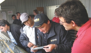 President Ewan Downie of Premier Gold Mines (with core) and project manager Matt Long (at right) examine drill core from the Rahill-Bonanza project in Red Lake, Ont.